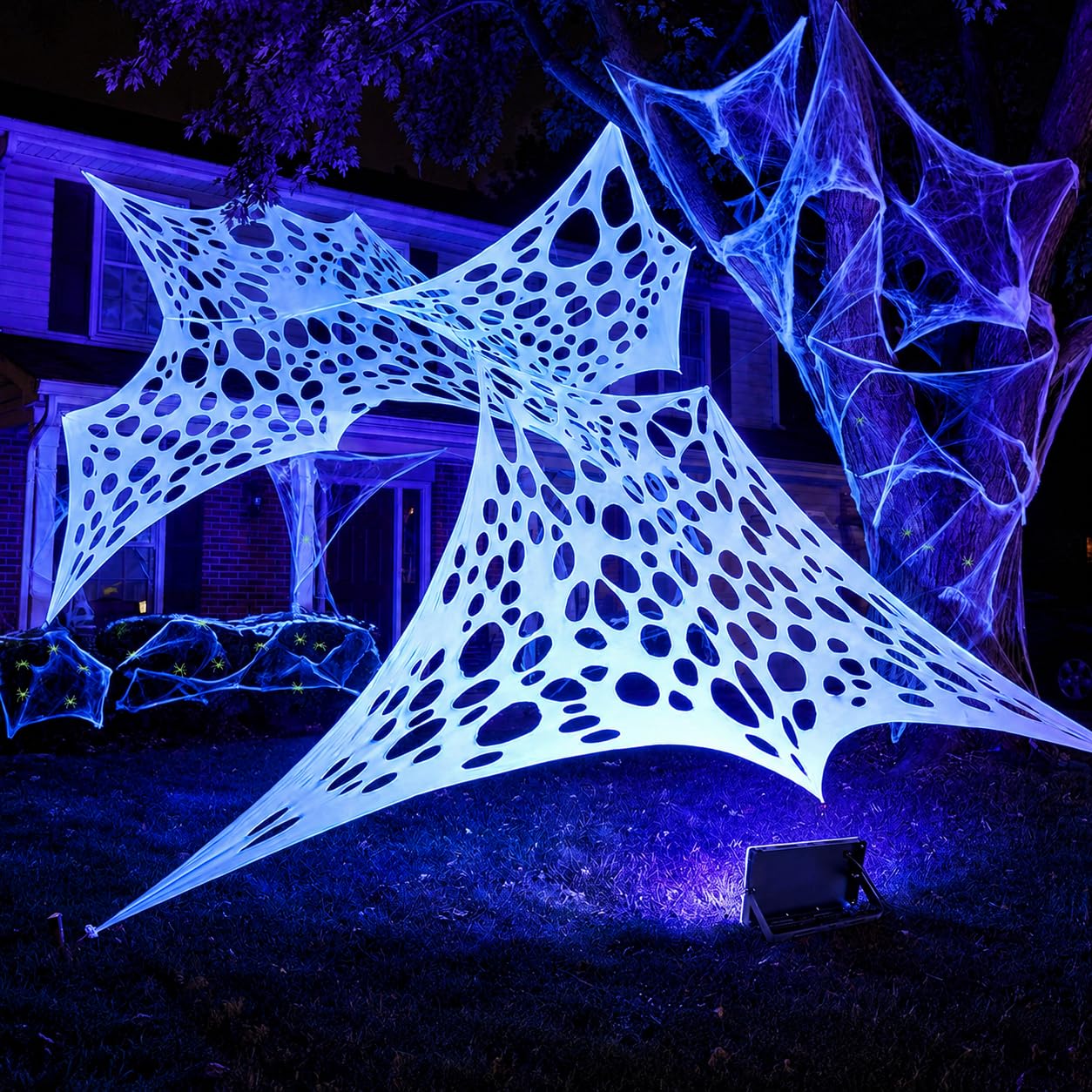 Fluorescent white spider web glowing in the dark