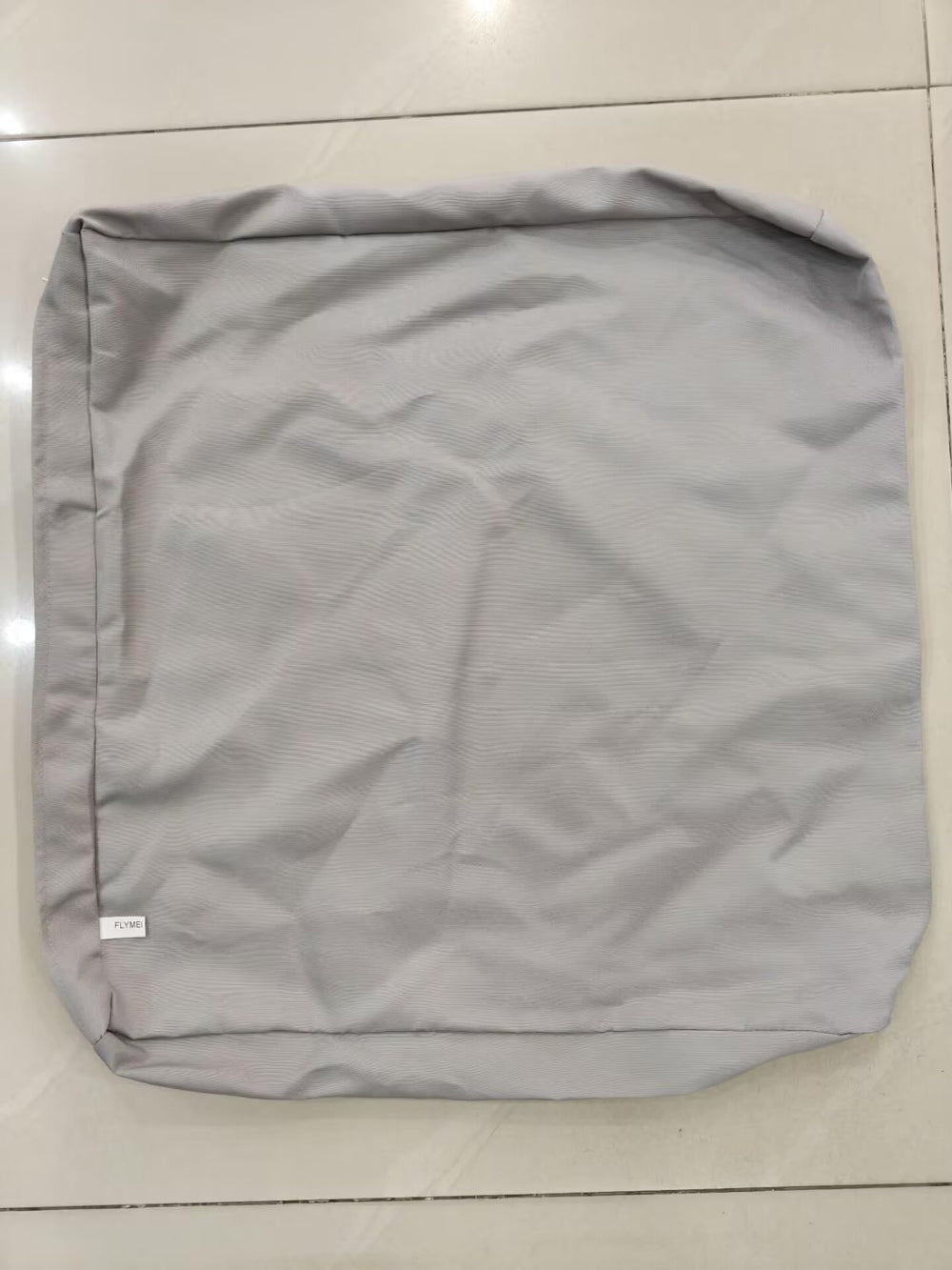 FLYMEI Patio Cushion Covers Grey on a sofa