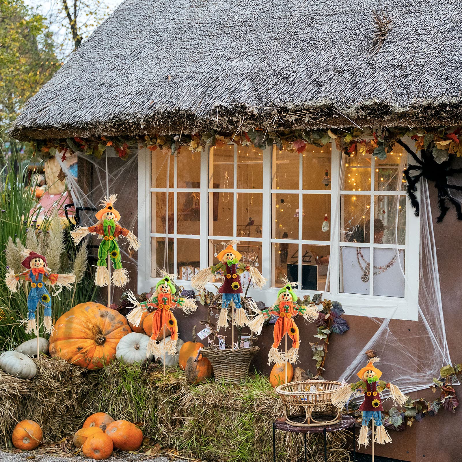 Four different styles of ZAUGONTW Halloween scarecrows lined up