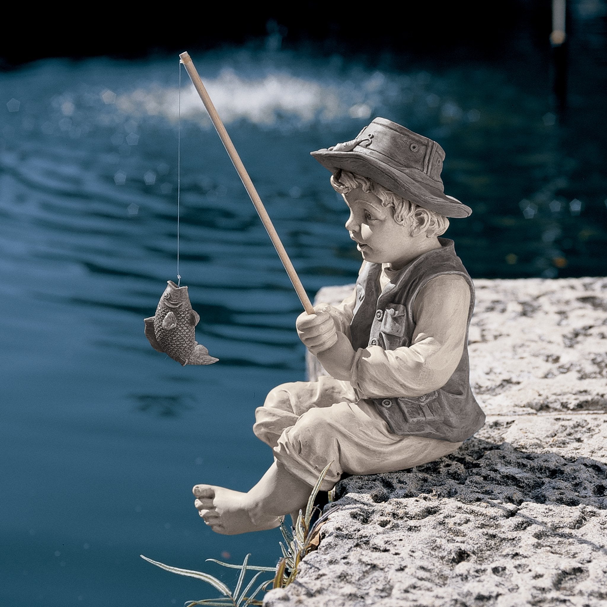 Frederic the Little Fisherman statue close-up of the fish on pole