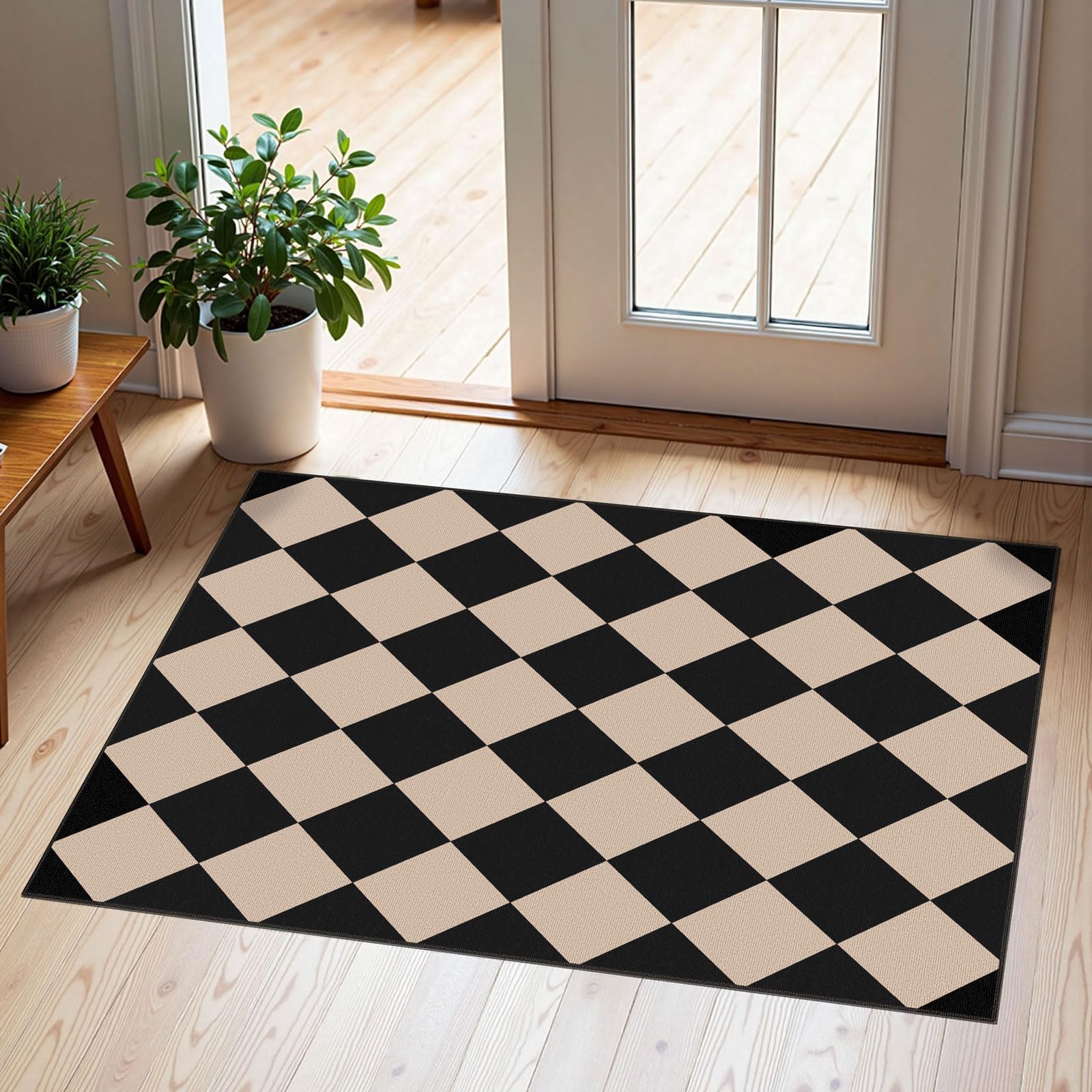 Front view of Othilic indoor outdoor door mat in black and tan checkered pattern