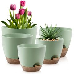 Front view of QRRICA self-watering pots set in green