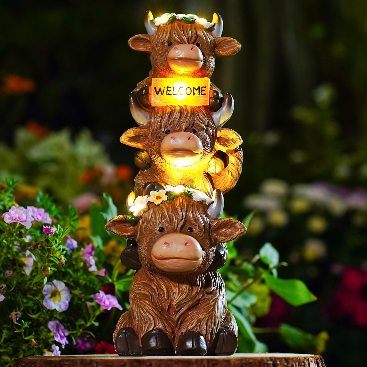 Front view of the twinbling Highland Cow Statue with floral accents