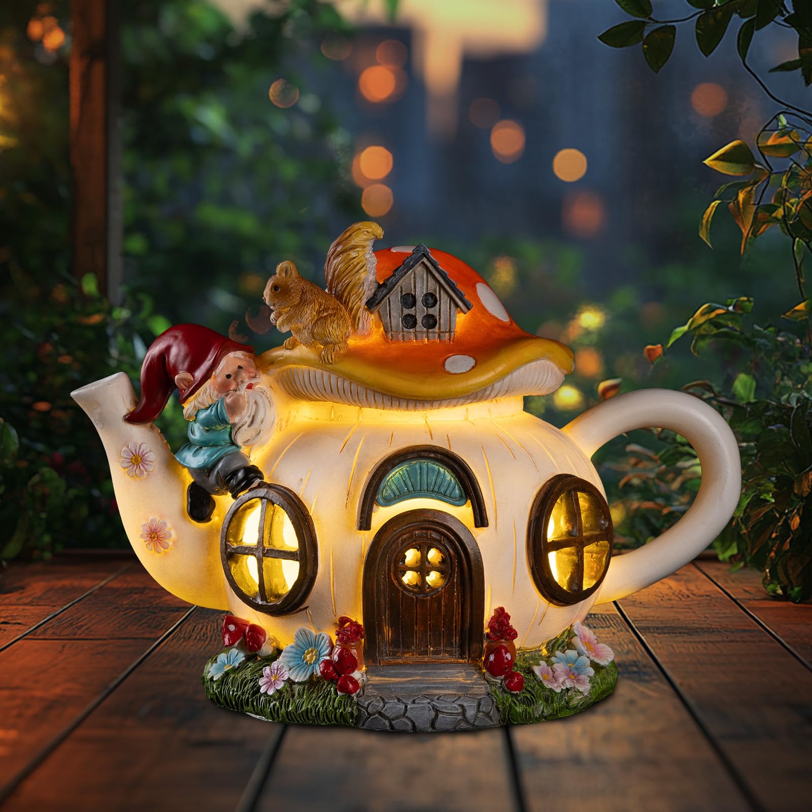 Front view of twinbling Solar Fairy House Garden Statue with gnome and squirrel