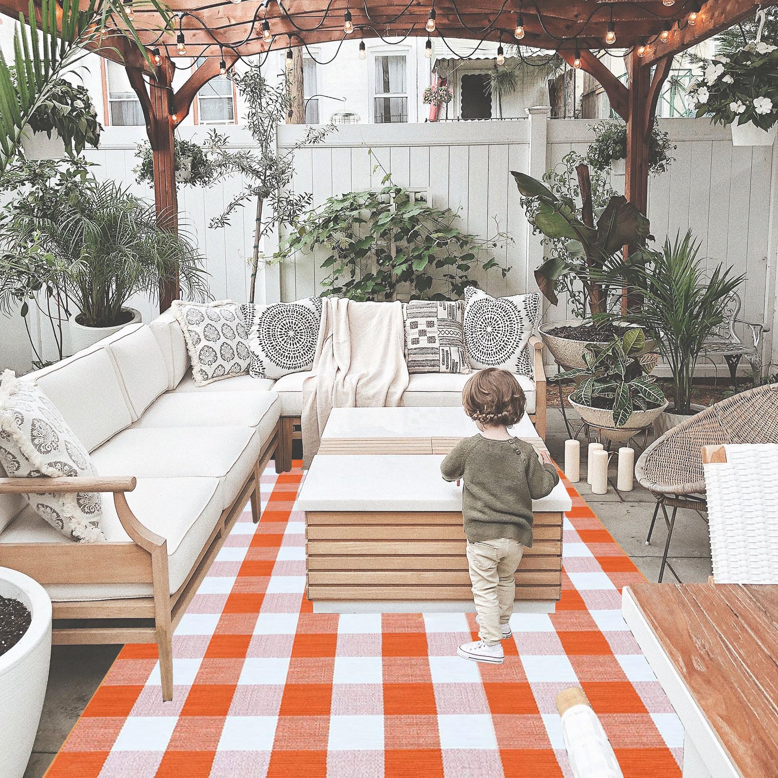 Full view of CAINANEL outdoor rug in garden setting