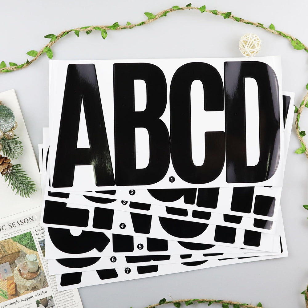 Full view of CMBBZZY vinyl letters and punctuation stickers