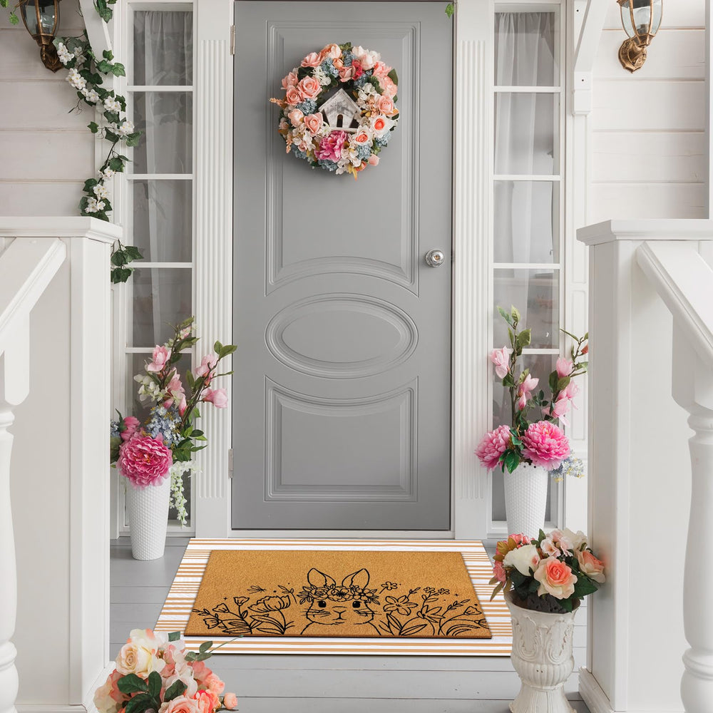 Full view of the beige striped rug from the doormat set