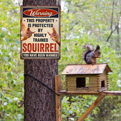 Funny Squirrels Sign displayed in a garden setting