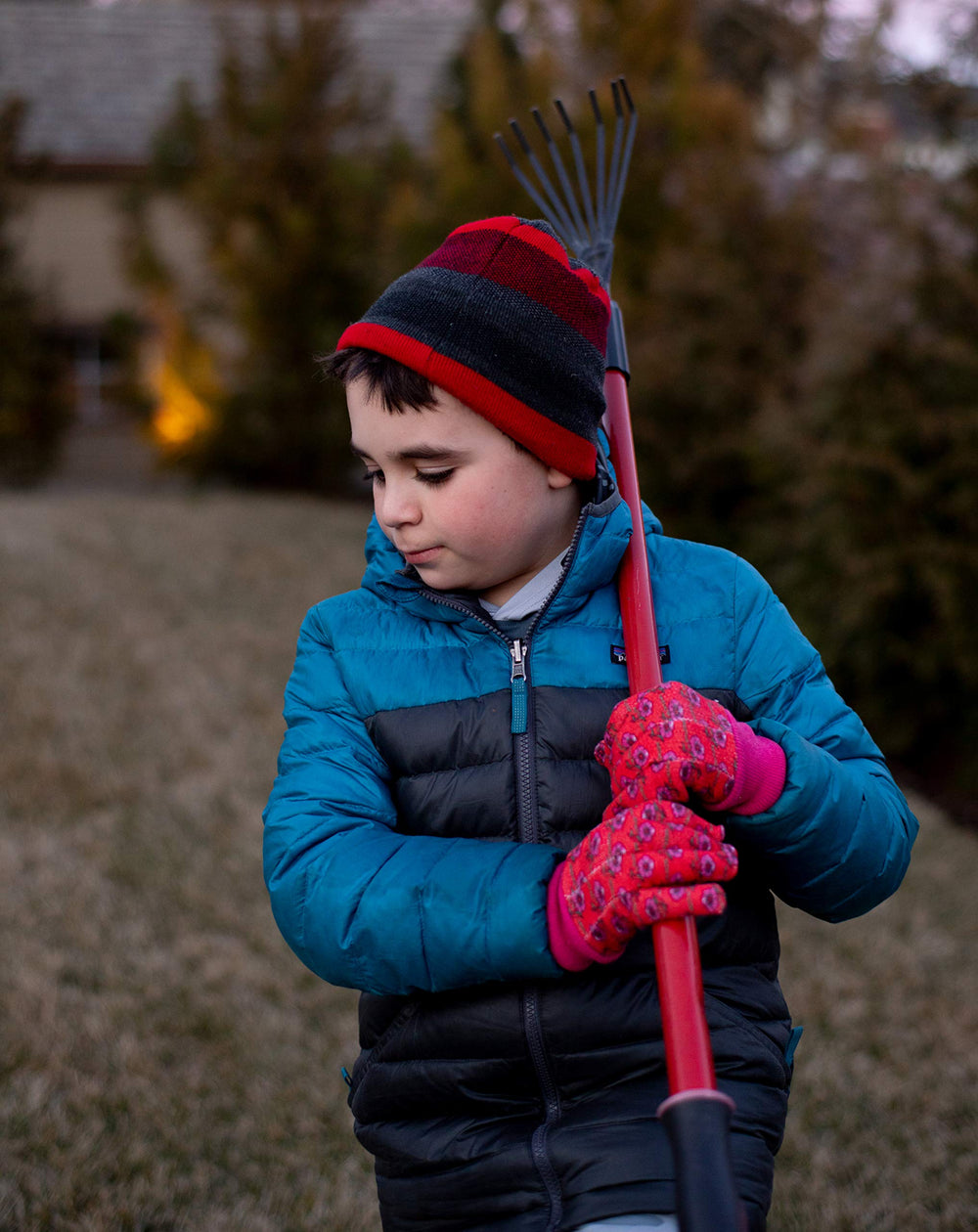 G & F Kids Garden Gloves laid flat on a garden background