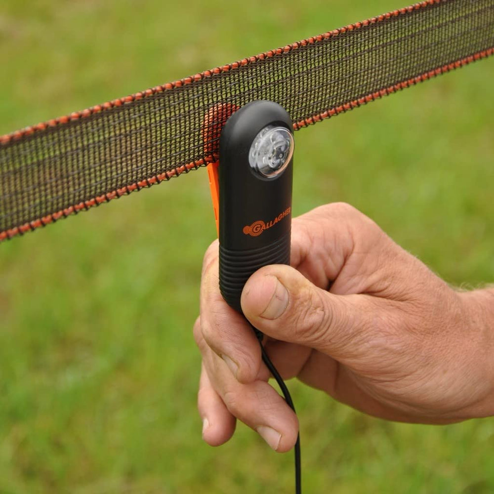 Gallagher Live Fence Indicator in a garden setting with pasture