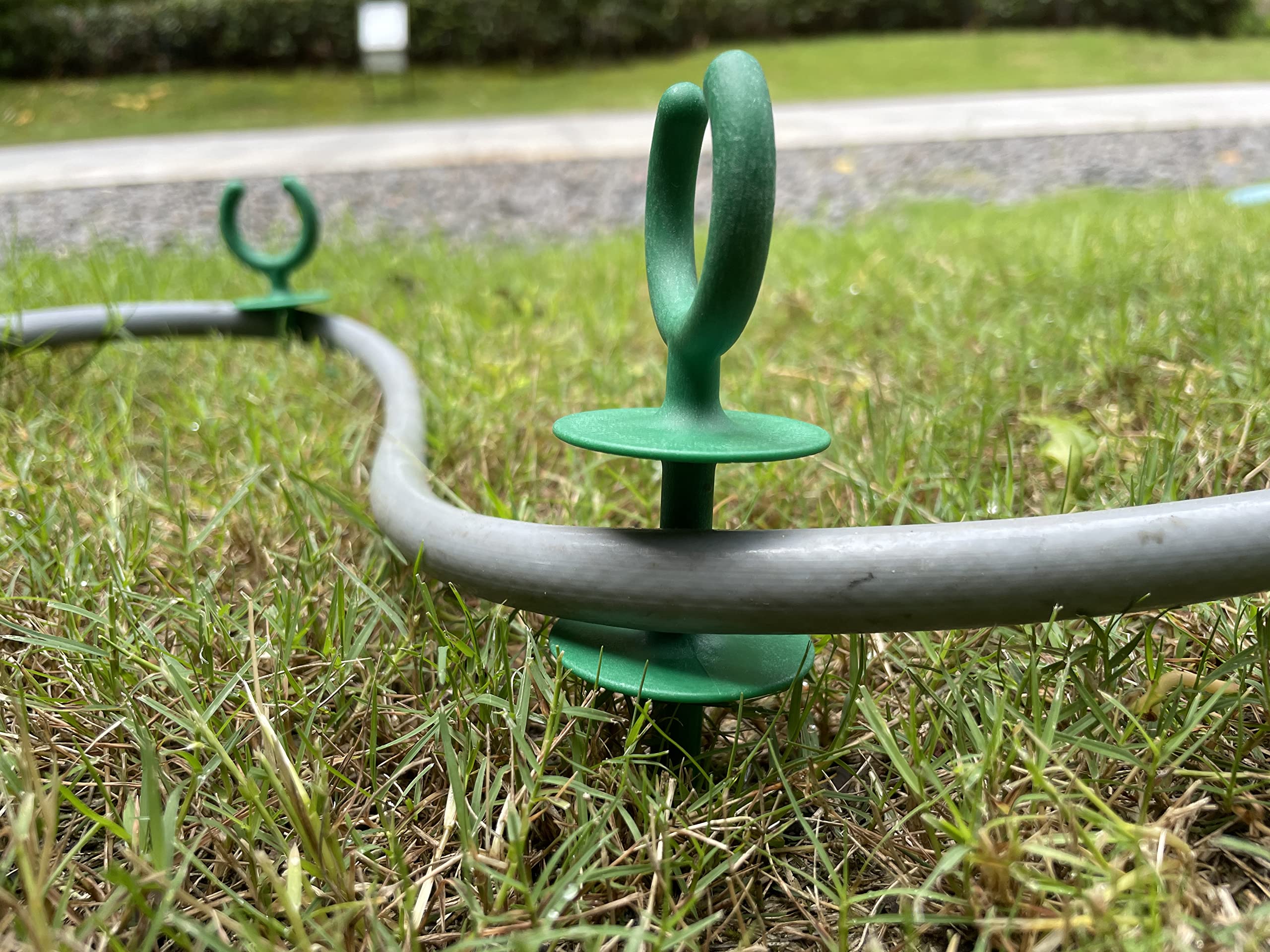 Garden hose guide stakes in various angles
