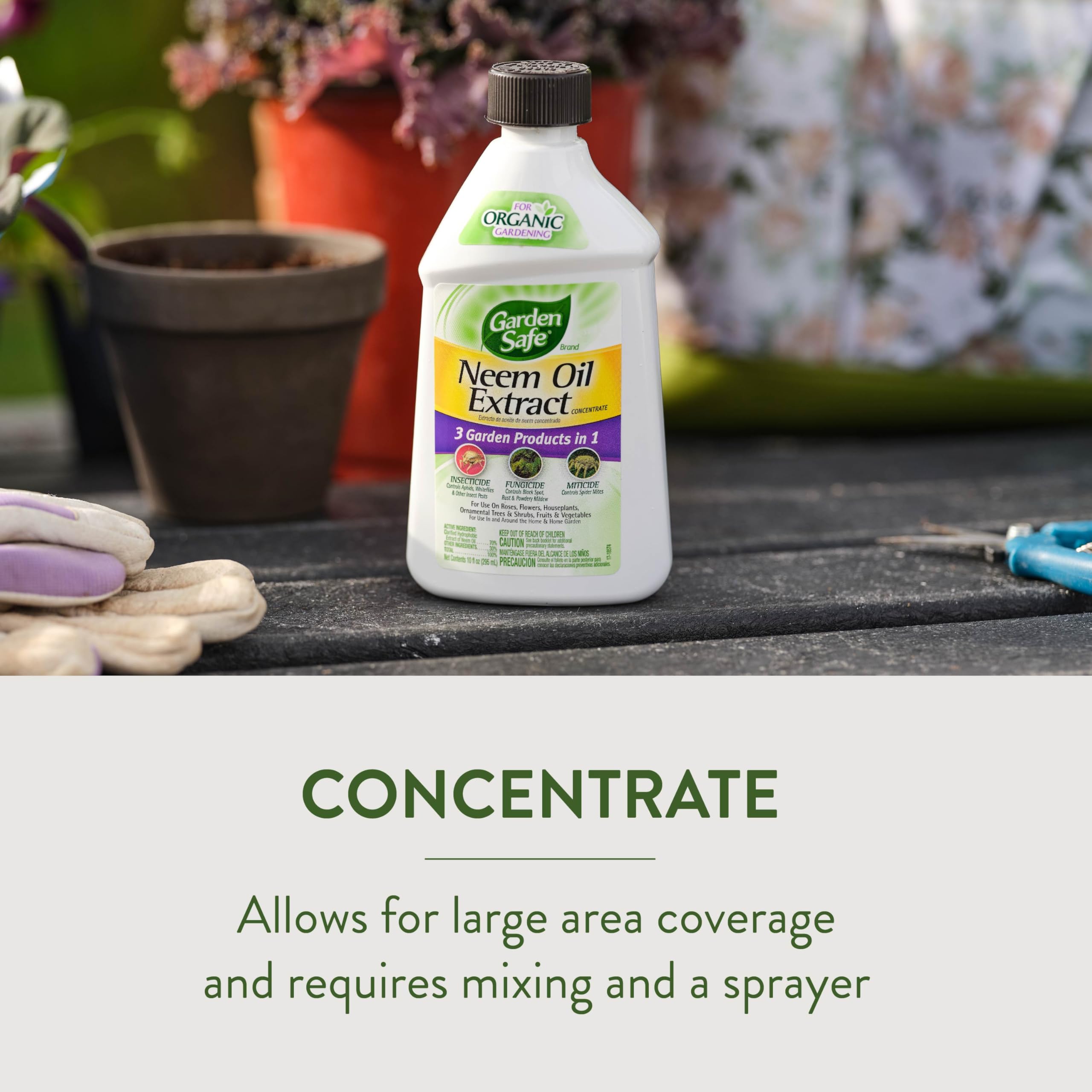Garden Safe Neem Oil Extract Concentrate with plants in the background