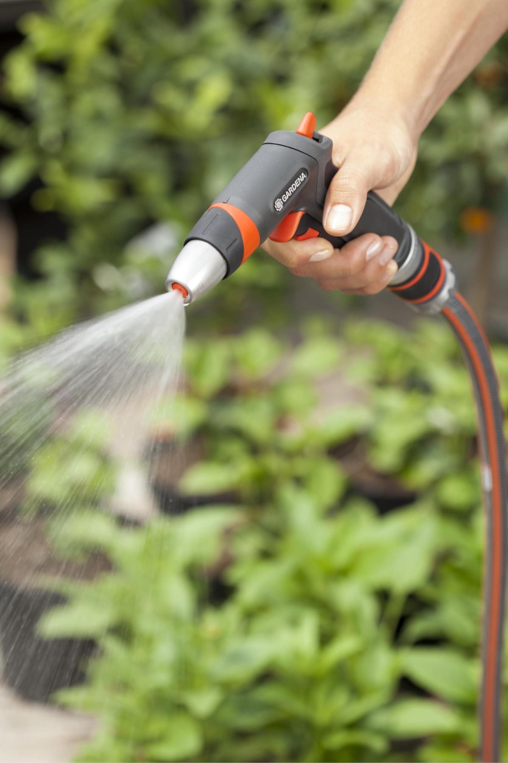 Gardena Premium Cleaning Nozzle displayed on a garden table