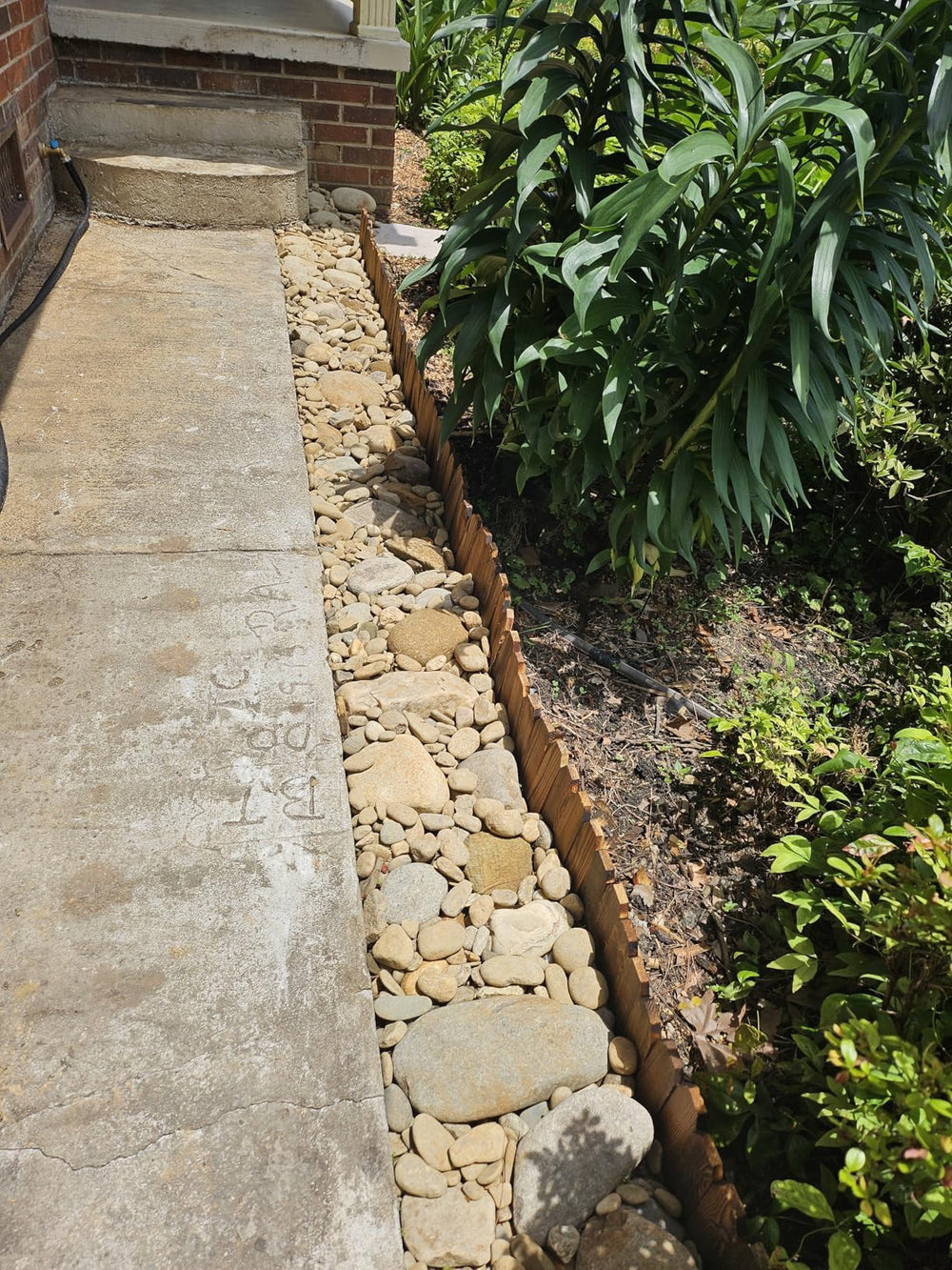 GardenFlow Wood Garden Edging in a rustic outdoor setting