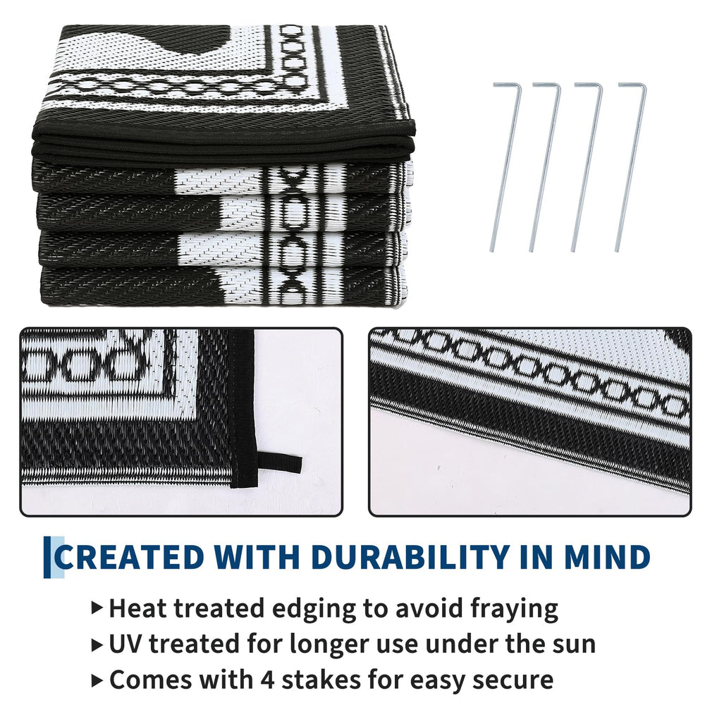 Garvee Outdoor Rug 5x8 with sand and drinks on it