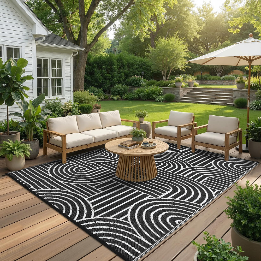 Garvee Outdoor Rug with heavy books to smooth creases