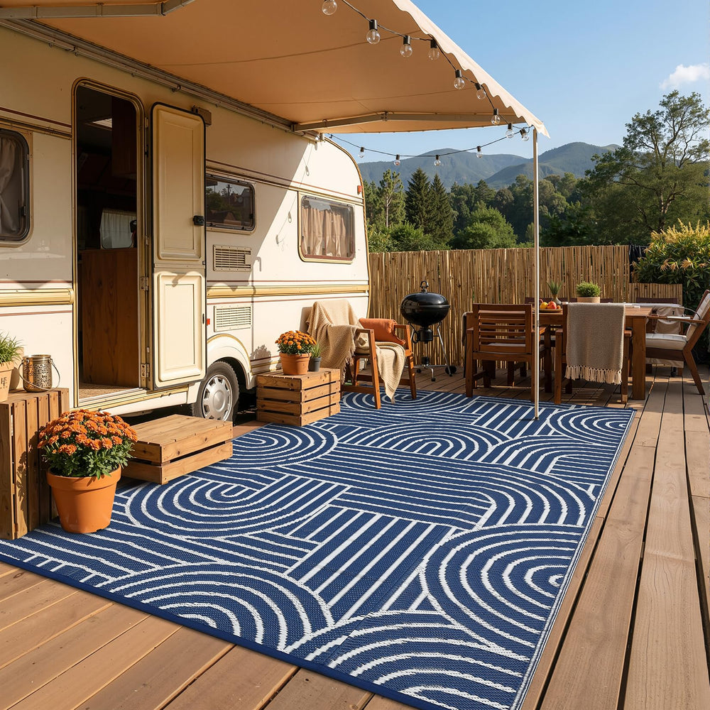 Garvee Reversible Rainbow Outdoor Rug 9x12 in use at the beach
