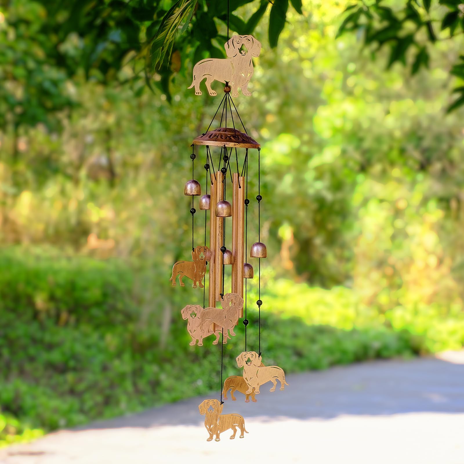 GDNSFIT Dachshund Wind Chimes hanging near a window
