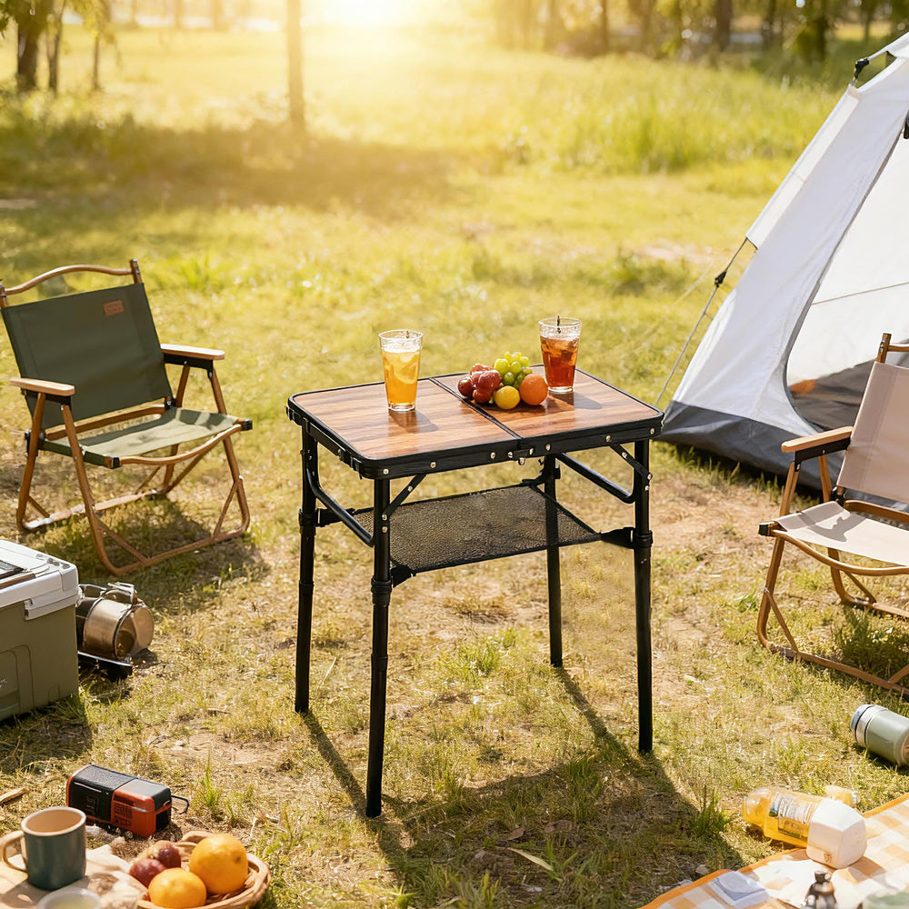 Geastsheng Small Folding Camping Table set up outdoors with food and drinks