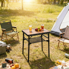 Geastsheng Small Folding Camping Table set up outdoors with food and drinks
