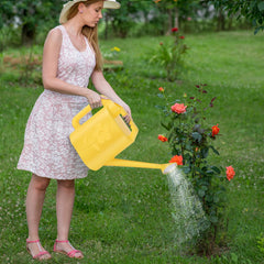 gegemaoyi 2 Gallon Watering Can in use watering indoor plants