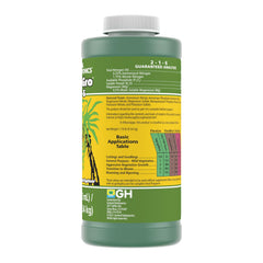 General Hydroponics FloraGro 2-1-6 Plant Food 16 oz next to potted plants