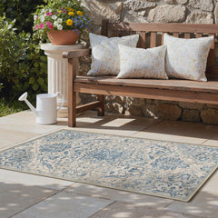 GENIMO 5x8 Outdoor Rug displayed in garden