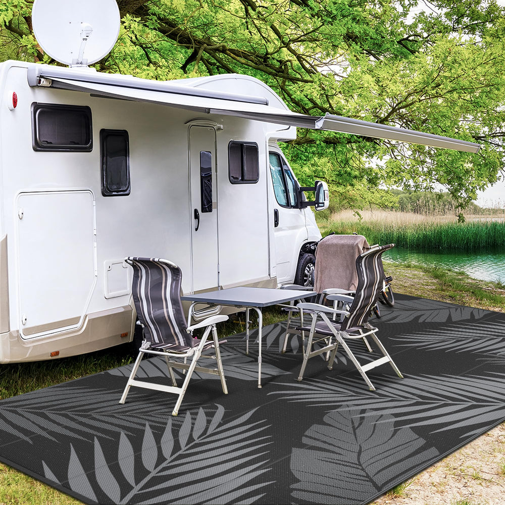 GENIMO Outdoor Rug 10'x14' displayed at a camping site