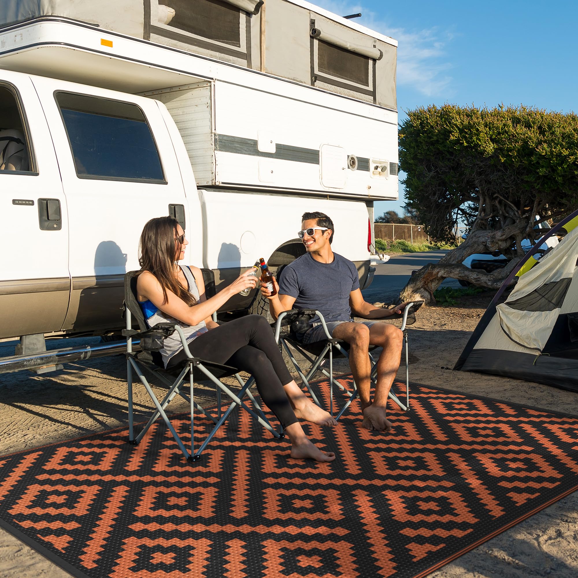 GENIMO Outdoor Rug 6'x9' Black Orange in camping setup