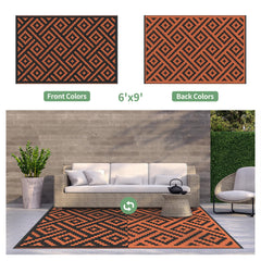 GENIMO Outdoor Rug 6'x9' Black Orange on patio