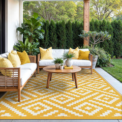 GENIMO outdoor rug showing reversible design with geometric patterns