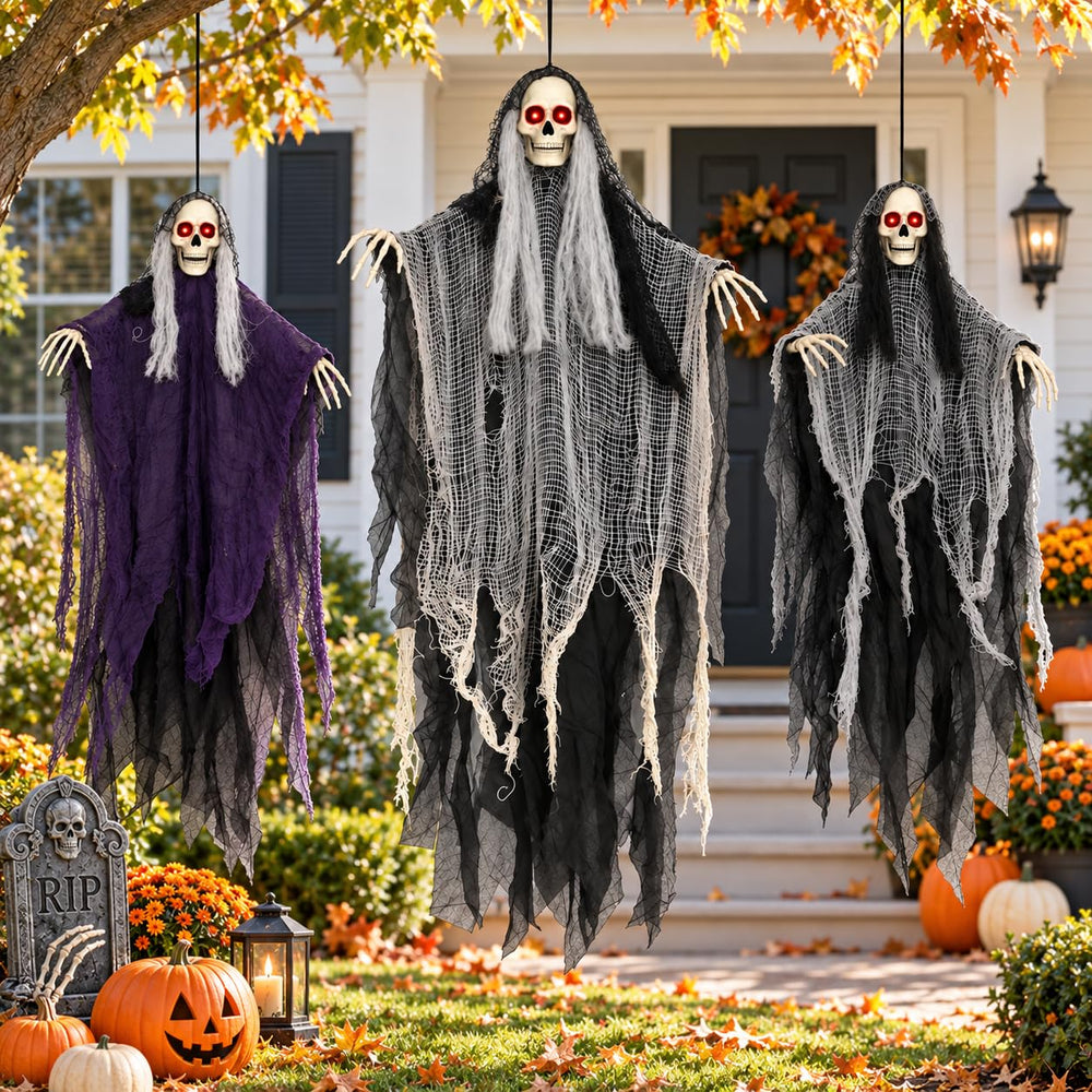 Ghosts fluttering in the breeze during a Halloween setup