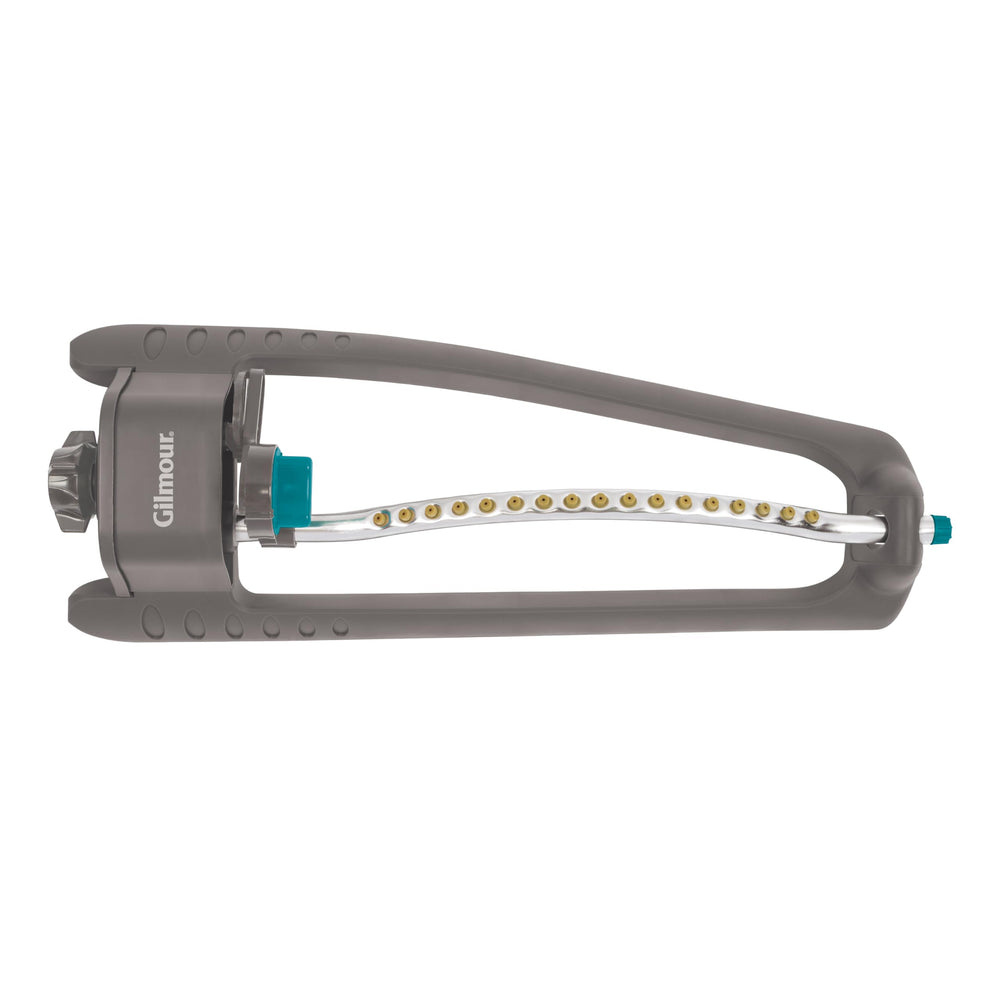 GILMOUR Adjustable Lawn Sprinkler attached to a garden hose