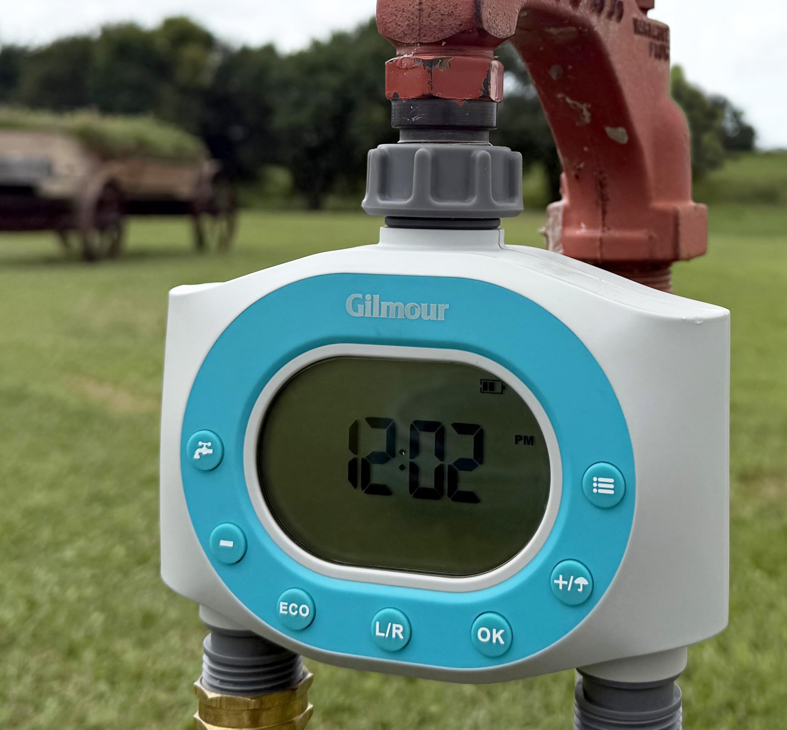 GILMOUR Dual Outlet Water Timer in use on a garden hose