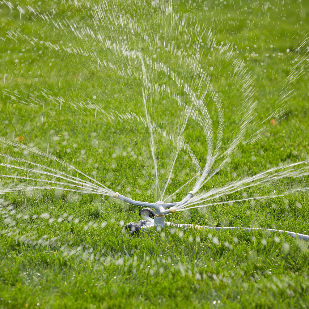 GILMOUR Heavy Duty Sprinkler in use watering flower beds