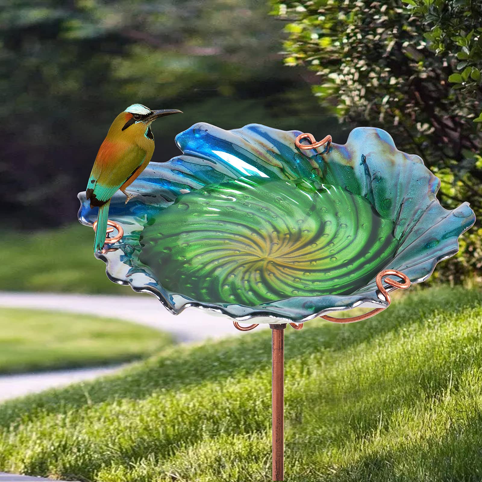 Glass bird bath in a garden setting