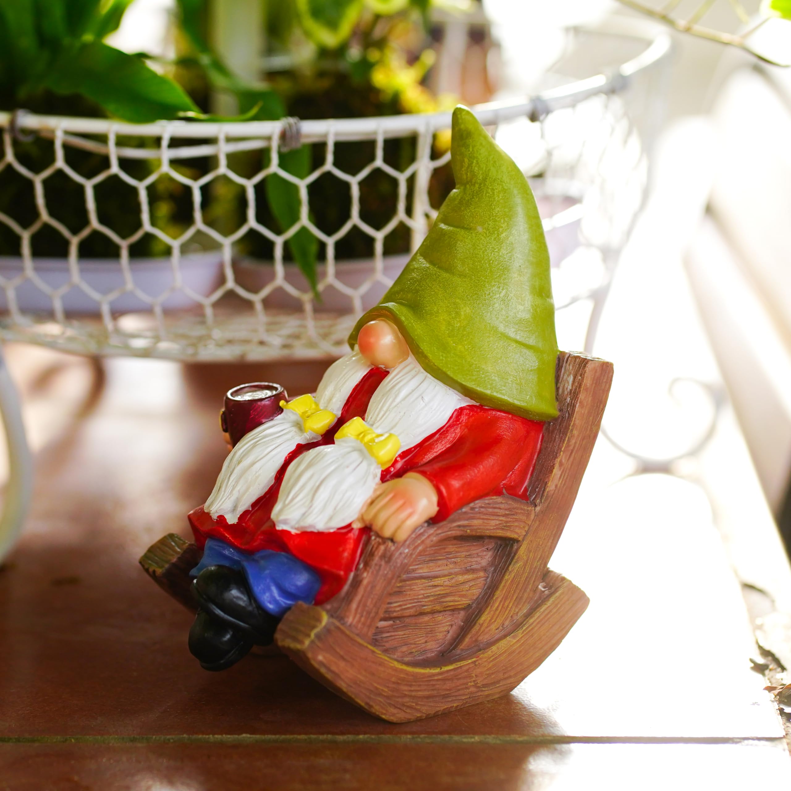 Gnome statue beside a rocking chair in a home interior