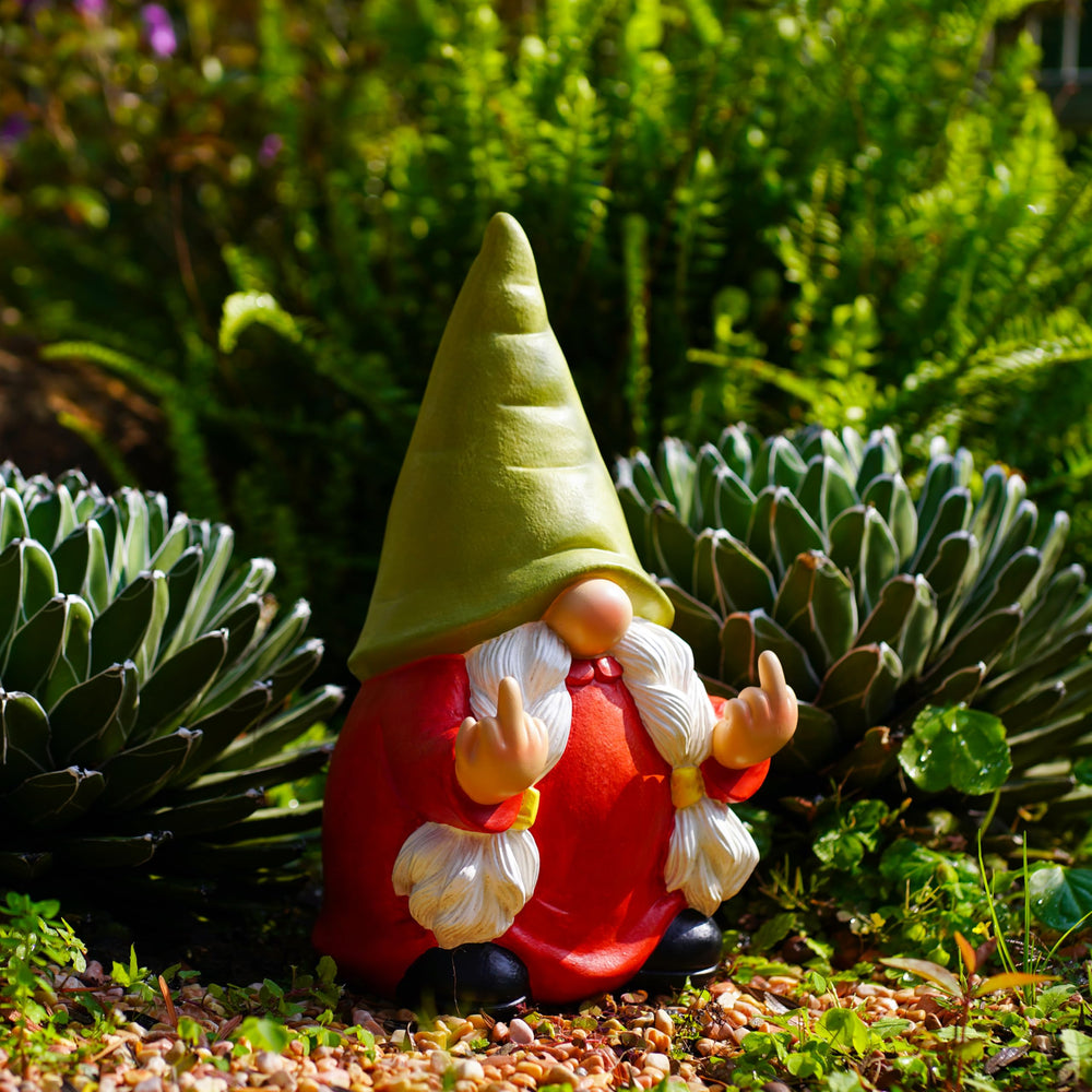 Gnome statue on a patio table with plants in the background