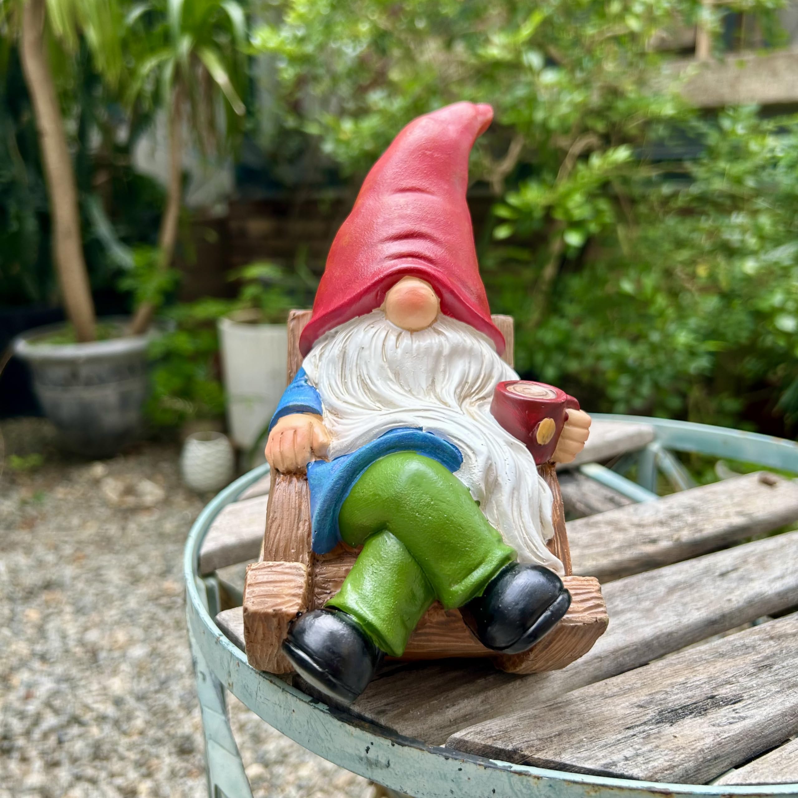 Gnome statue placed on a patio table with plants
