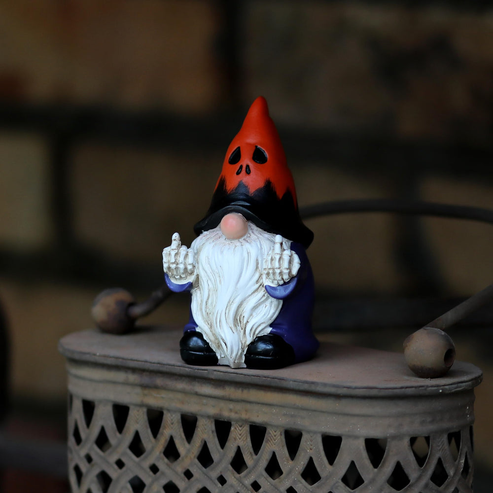 Gnome statue with Halloween decor setting