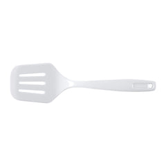 GoodCook slotted turner in use, transferring grilled food from barbecue