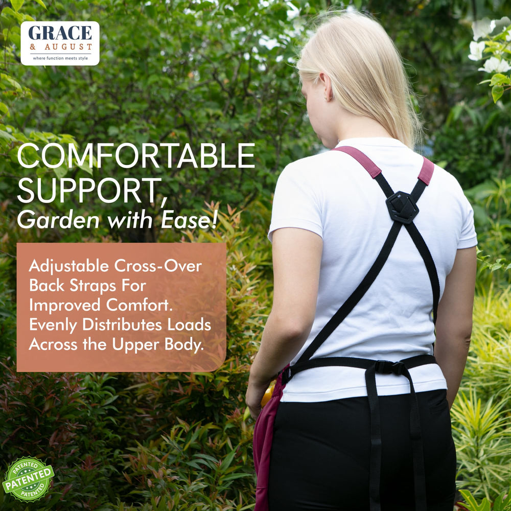 Grace and August Gardening Apron hanging on a garden fence