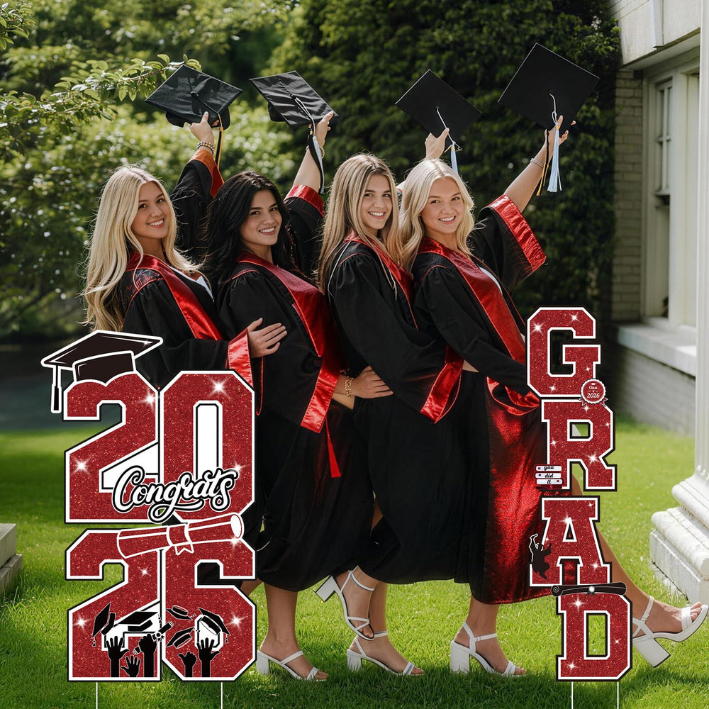 Graduation yard signs in red and black with stakes