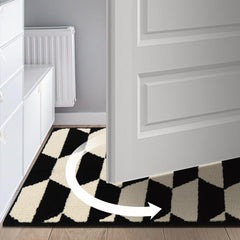 GRANNY SAYS Doormat in entryway with door open