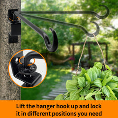 Greemov black iron plant hanger installed on a fence
