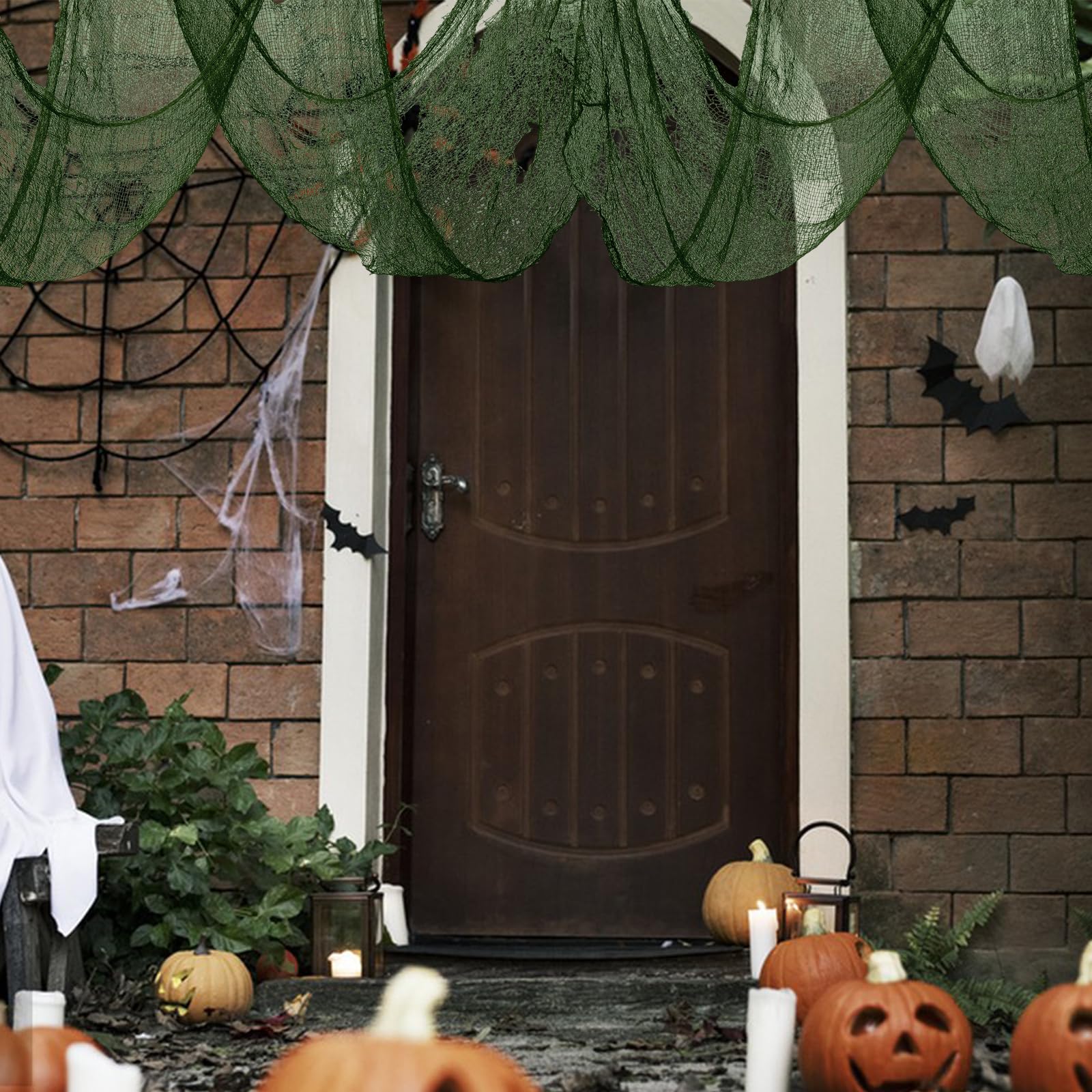 Green creepy cloth hanging from a doorway for Halloween