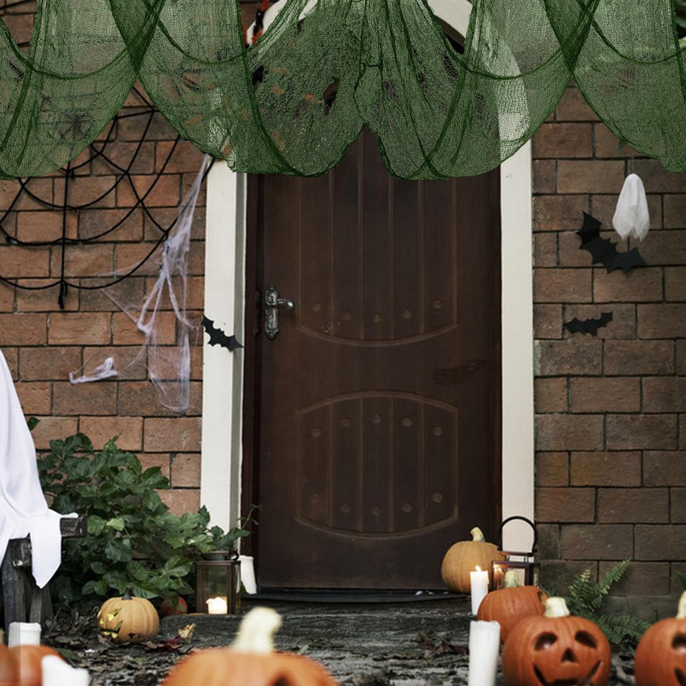 Green creepy cloth hanging from a doorway for Halloween