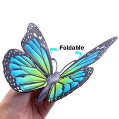 Green EOORAU butterfly wall art hanging on a tree