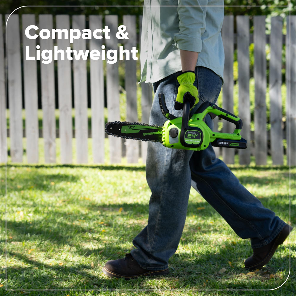Greenworks 24V Compact Electric Chainsaw in use outdoors