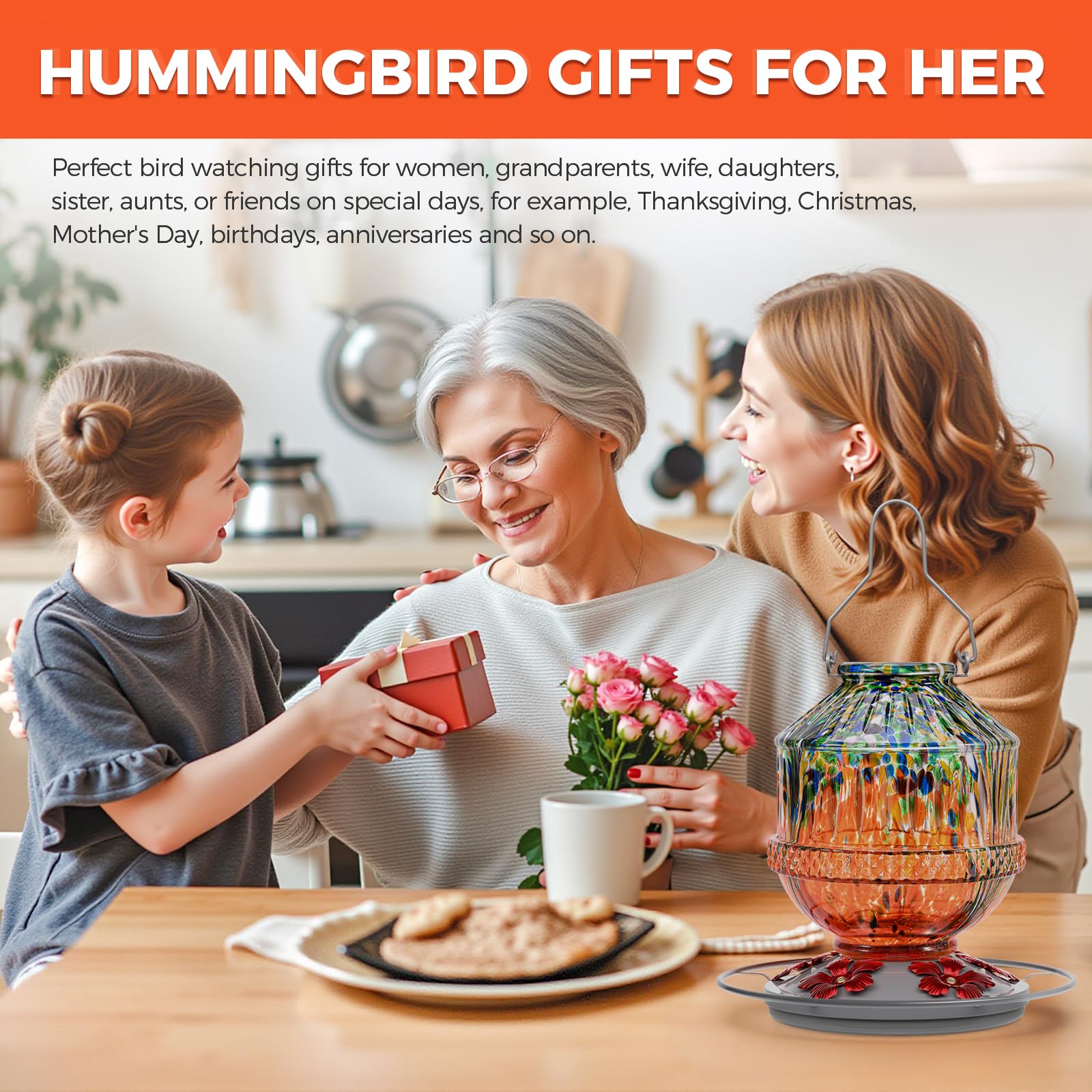 Grete Gotye Hummingbird Feeder in outdoor setting with flowers